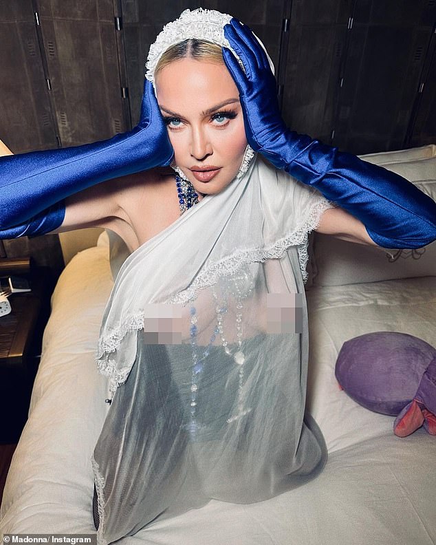 Oh my: Madonna put on an extremely daring display when she went topless under a sheer scarf for her latest sizzling round of Instagram photos on Friday