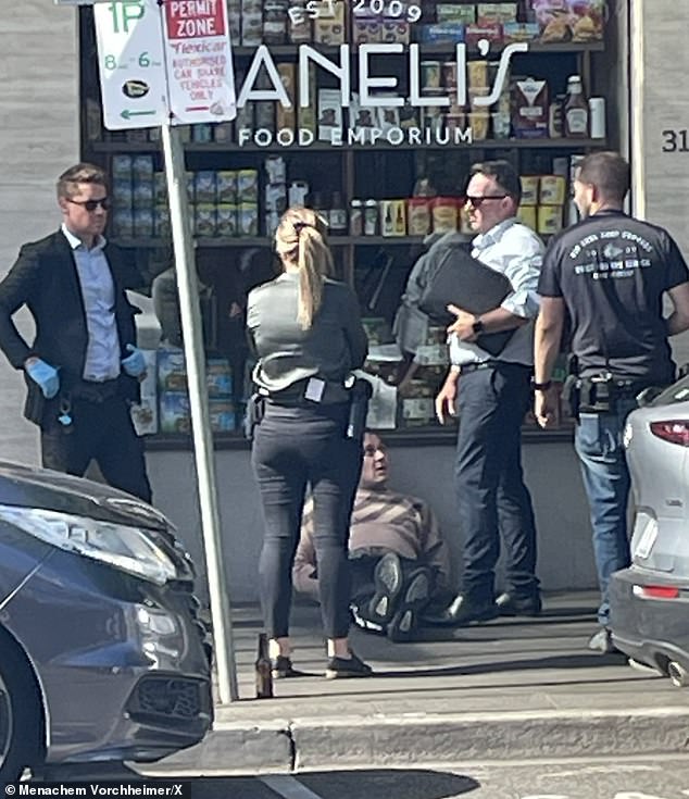 Two men are in 'handcuffs' after a major police operation on Carlisle Street on Balaclava, in Melbourne's south-east, on Wednesday afternoon