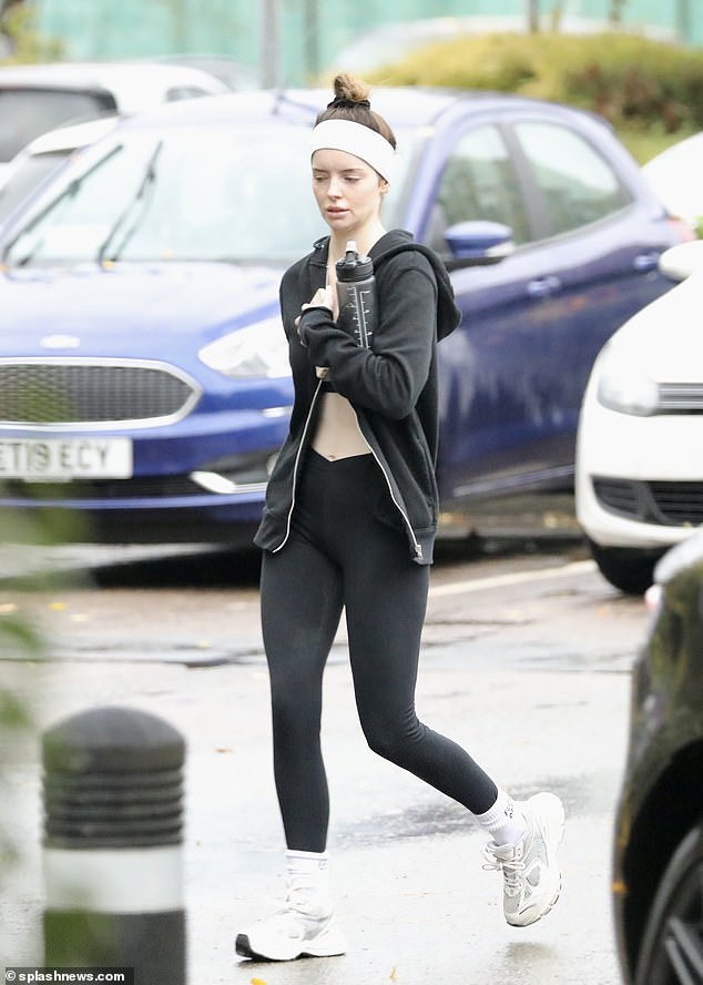 Make-up free: Maura Higgins, 32, cut a sporty figure in a black crop top and leggings as she left a grueling workout session on Wednesday