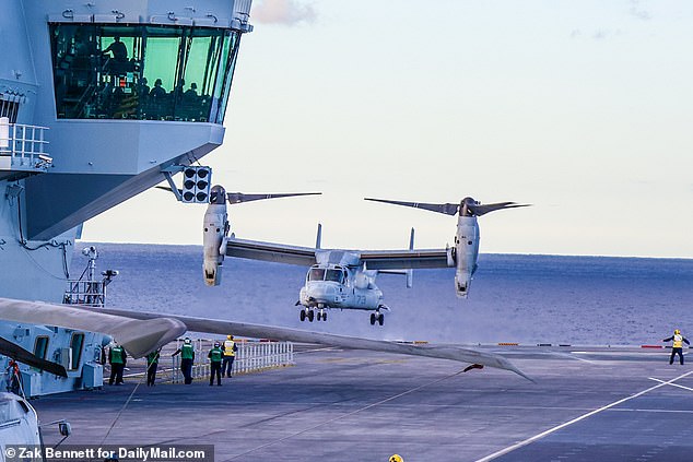 An American MV-22 Osprey, from test squadron HX-21, lands in the cockpit with its unique tilt-rotor design.  The tests are all part of expanding the Royal Navy's capabilities