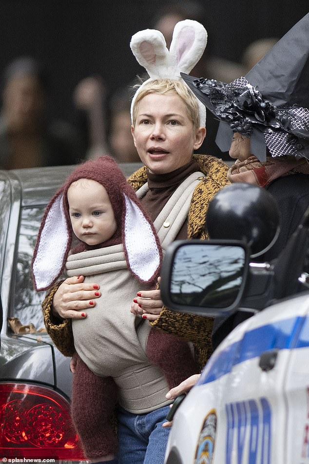 Squeeze!  Michelle Williams and her youngest child wore bunny costumes while trick-or-treating near their $10.8 million mansion in Brooklyn Heights on Halloween