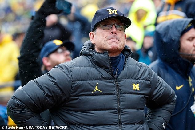 Michigan coach Jim Harbaugh is serving a three-game suspension for the sign-stealing scandal