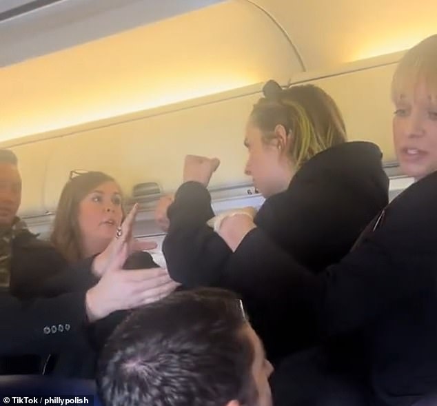 A woman clashed with flight attendants on a Southwest Airlines flight after repeatedly shouting that she was a victim of human trafficking