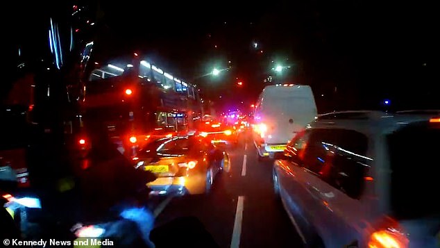 The footage begins with the rider weaving through London traffic during a delivery ride