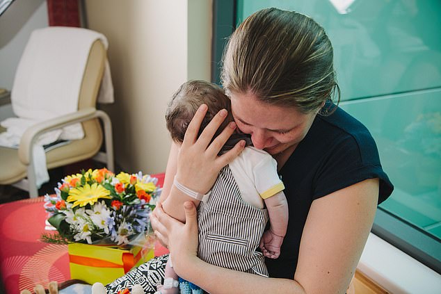 Amylee Magalhaes, 34, held her three-day-old baby in her arms for the very first time as he took his last breath