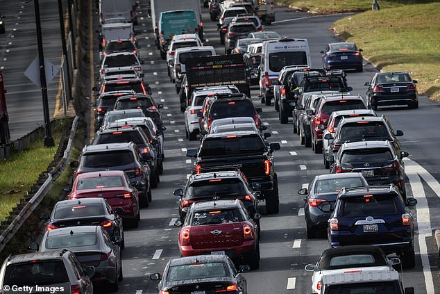 Heavy traffic moves along Interstate 295 in Washington, DC on Wednesday before Thanksgiving