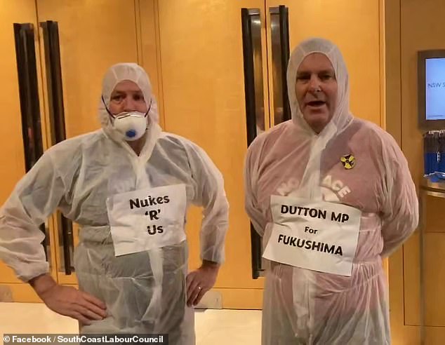 Protesters were escorted from the NSW Liberal Party conference at Sydney's Fullerton Hotel on Saturday after turning up in hazmat suits claiming to be Peter Dutton.