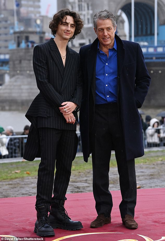 Pleasure!  His co-star Hugh, who plays an Oompa Loompa, opted for a sharp all-blue look as he attended the photocall