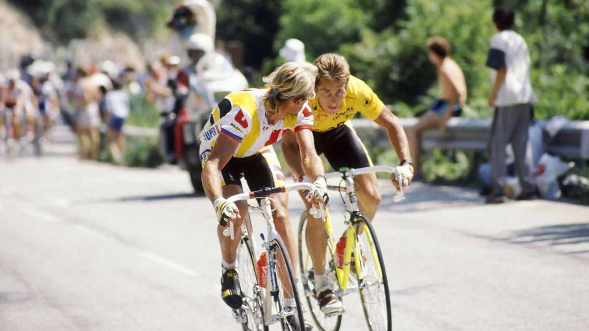 Greg LeMond rides alongside another cyclist during the Tour de France in The Last Rider.