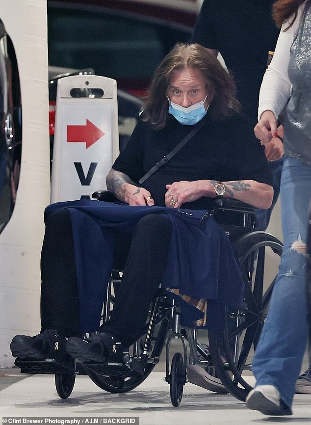 Unwell: The rocker told the publication that recent back surgery has left him 'practically crippled' (pictured earlier this month)