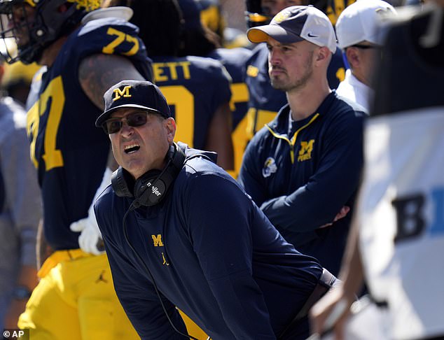 Michigan is recruiting analyst Connor Stalions who is right behind head coach Jim Harbaugh