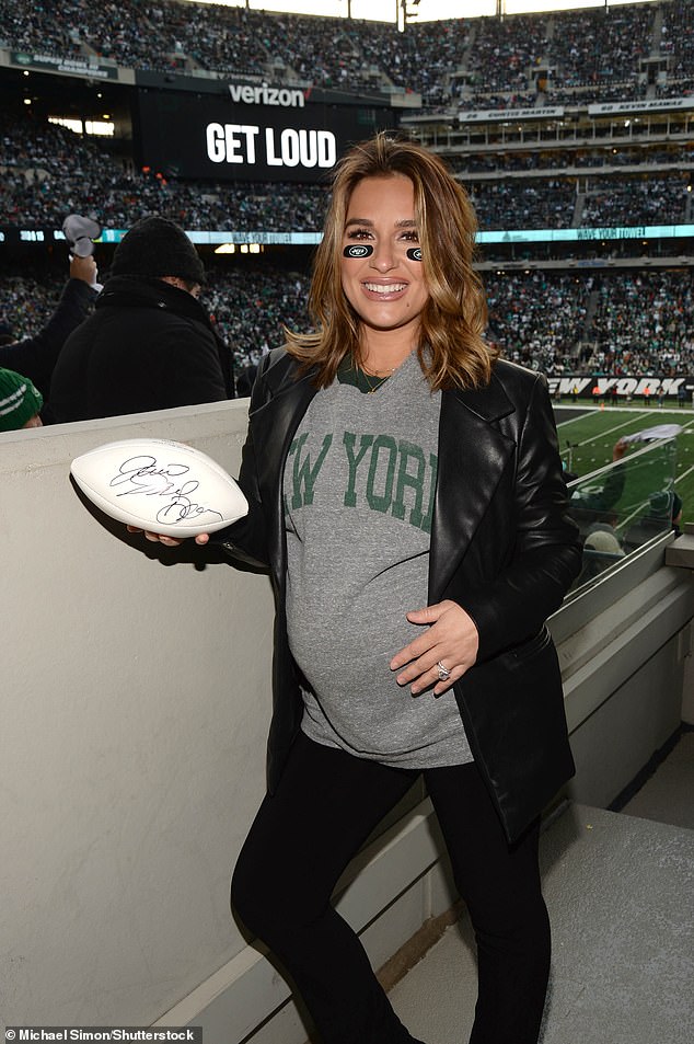 Team spirit: Jessie James Decker, 35, enjoyed a soccer game with her family on Friday.  The entrepreneur was spotted in a gray T-shirt and showed off her growing baby bump