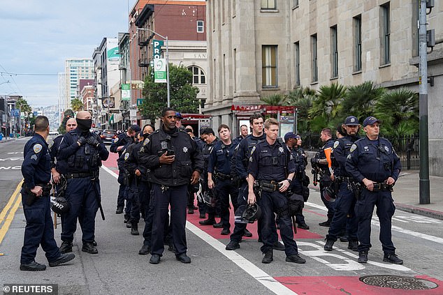 Protesters clashed with riot police as thousands of people took to the streets of San Francisco on Wednesday morning to 'shut down' the APEC summit.