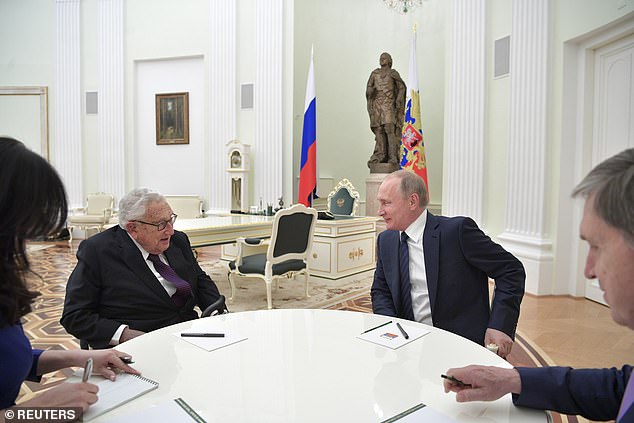 Putin pictured with Kissinger in Moscow in June 2017, the pair had had a friendship since the 1990s