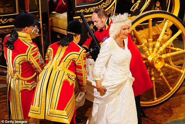 Getting out of the carriage on the way to the House of Lords took 'a long time' for Camilla and required 'a lot of help' as she seemed nervous and hesitant about using the steps in her heavy dress and long train