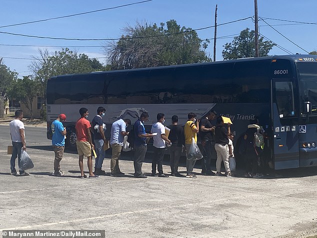 Migrants board an Abbott bus in Del Rio, Texas, bound for Chicago