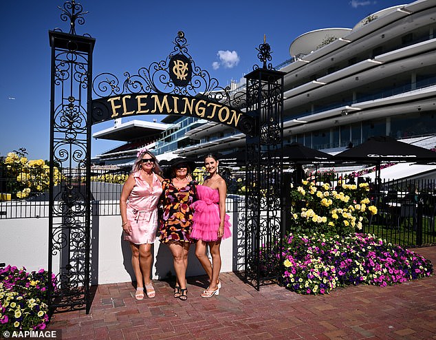 The Coalition for the Protection of Racehorses accused Racing Victoria of covering up the death (photo, three women at Flemington race track)