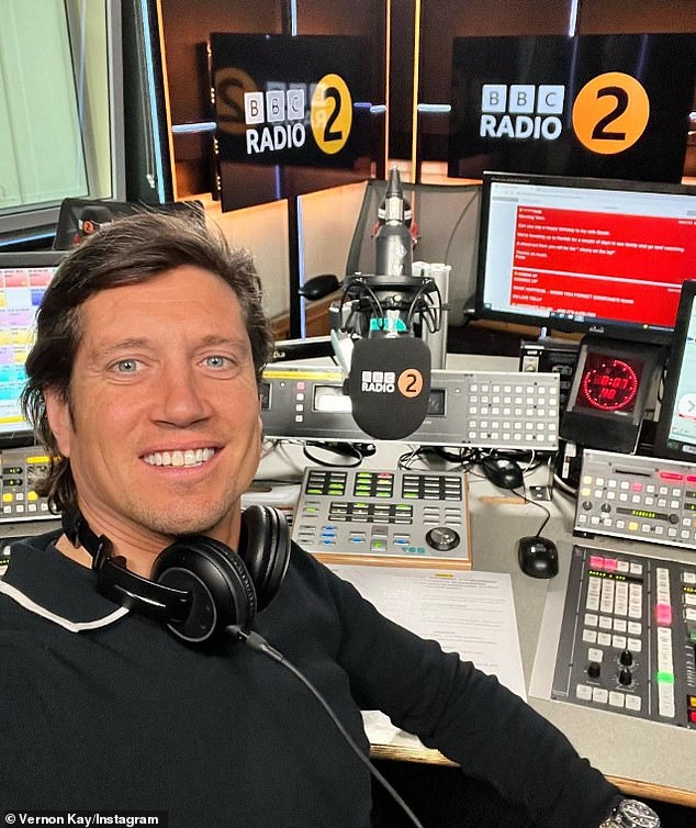 No hard feelings: Vernon Kay, 49, has revealed how he often bumps into pastor Ken Bruce, 72, on his way to work after taking over the DJ's BBC Radio 2 show earlier this year (Vernon pictured in the Radio 2 studio)