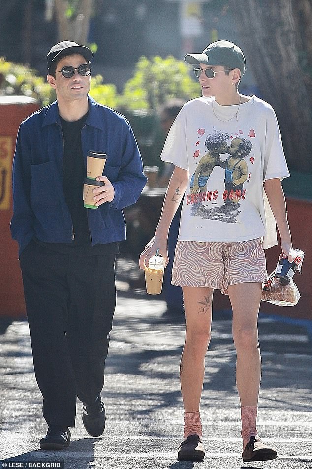 New lovers: Rami Malek and his new partner, Emma Corrin, were spotted on a romantic walk in Los Angeles on Wednesday