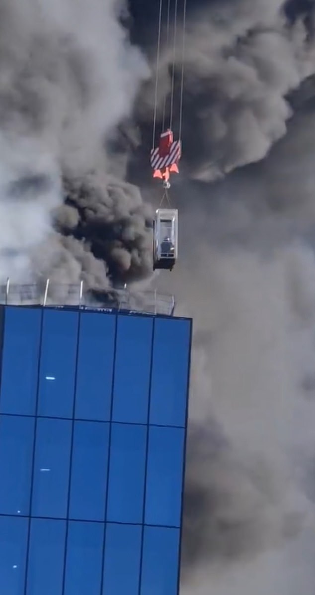 A huge fire has broken out in a busy city centre, sending clouds of smoke into the air