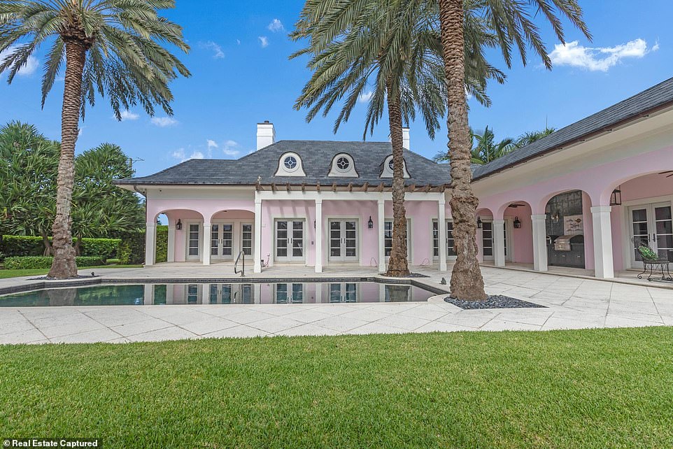 The four-bedroom pink house, located in Manalaplan, Florida, is for sale for $6.8 million