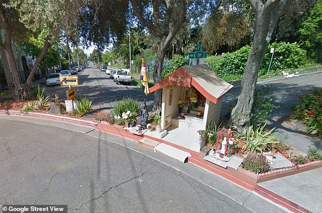 Oakland resident Dan Stevenson installed a store-bought Buddha statue on a traffic divider (above) in his Eastlake neighborhood — a random attempt to deter crime