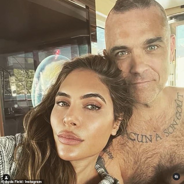 'There is no sex after marriage!'  Robbie and his wife Ayda Field, 43, have admitted they are hardly EVER intimate but insisted they are 'happy' with their lack of bedroom activity