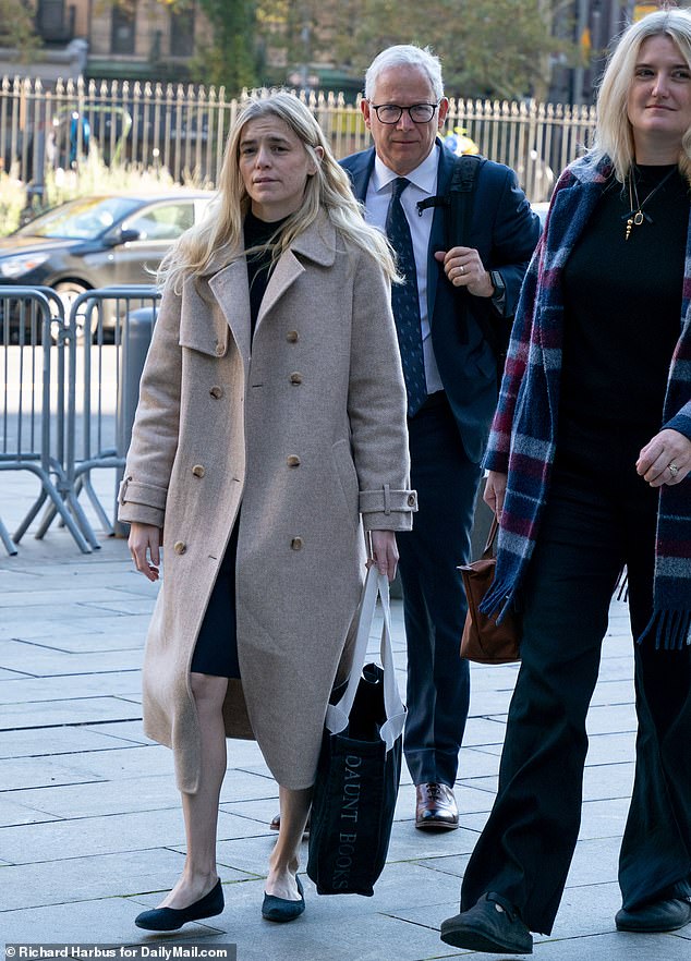 Graham Chase Robinson is pictured outside Manhattan Federal Court on Monday.  During Tuesday's hearing, she claimed she was too afraid to report her former boss Robert De Niro's alleged abuse for fear he would destroy her career.