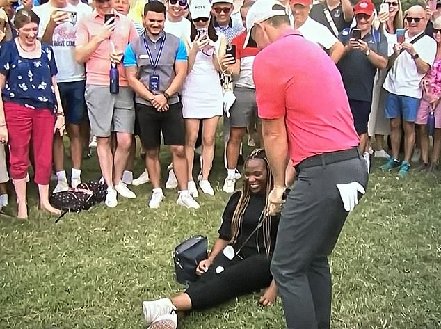 This spectator can't help but laugh after Mcilroy's ball landed on her lap after a bad tee shot