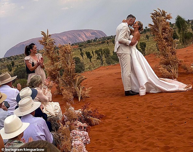 AFL power couple Abbey Holmes and Keegan Brooksby were married in an intimate ceremony at Uluru in the Northern Territory on Tuesday.  Both shown