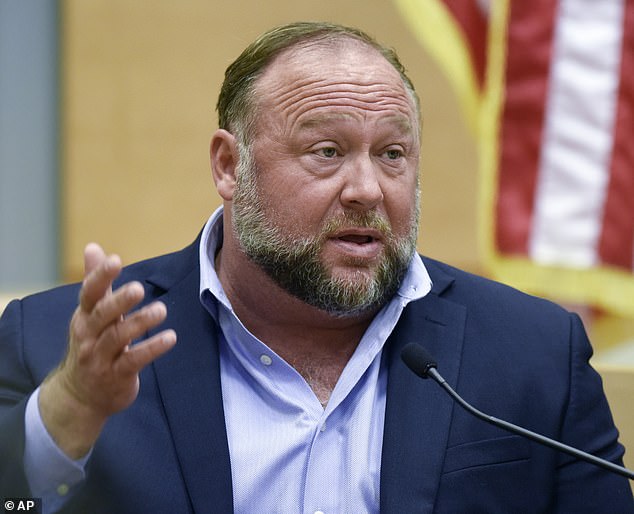 The Infowars host, seen here, filed for bankruptcy last year, just months after being told he would have to pay $965 million in damages and another $473 million in punitive damages