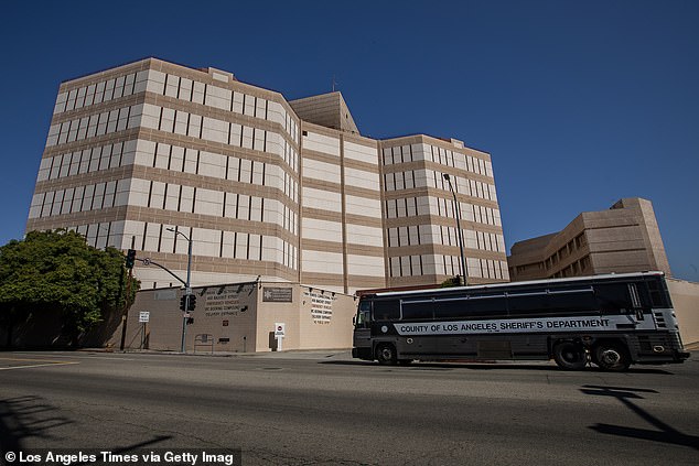 A County of Los Angeles Sheriff's Department bus drives past Tower One of the Men's Central Jail, as seen from Vignes Street in downtown Los Angeles