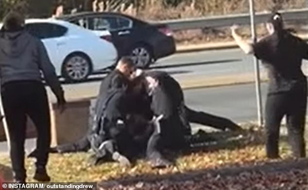 A shocking video shows the moment North Carolina police repeatedly punched a woman while restraining her on the ground