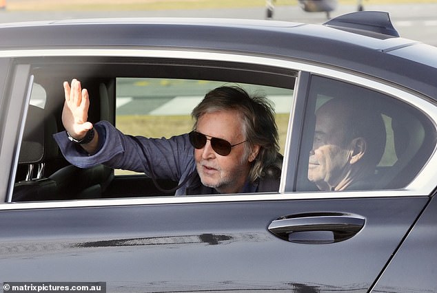 Sir Paul McCartney (pictured) was all smiles as he greeted fans after arriving in Brisbane for the Queensland leg of his tour after playing two sold-out concerts in Sydney