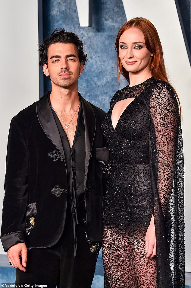 Awkward: Sophie Turner, 27, shared a raunchy kiss with Britain's most eligible bachelor, Peregrine Pearso, 29, in Paris just a month after her ex Joe Jonas, 34, filed for divorce