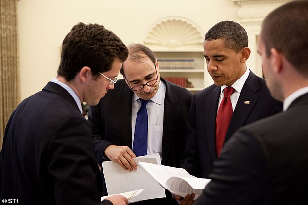 “If (Biden) continues to run, he will become the Democratic Party's nominee,” Axelrod (above, center) grumbled on Twitter.  'What he has to decide is whether that is wise;  Whether it is in HIS interest or in that of the country?'