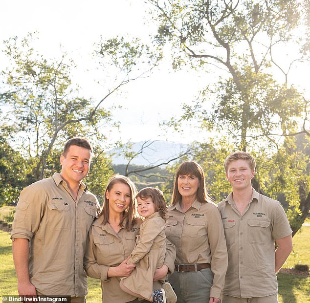 After his death, Steve's family, including his daughter Bindi, 25, widow Terri, 59, son Robert, 19, and son-in-law Chandler Powell, 27, continued his conservation work at the Australia Zoo (all pictured with two-year-old Grace Warrior)