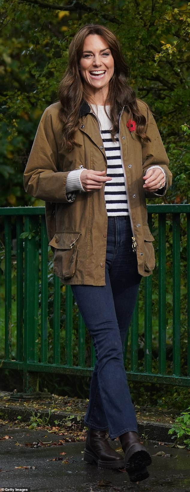 Ideally dressed for the rainy weather, the royal mother of three teamed the look with dark blue jeans and another re-worn £200 khaki Barbour jacket and Blundstone Chelsea boots