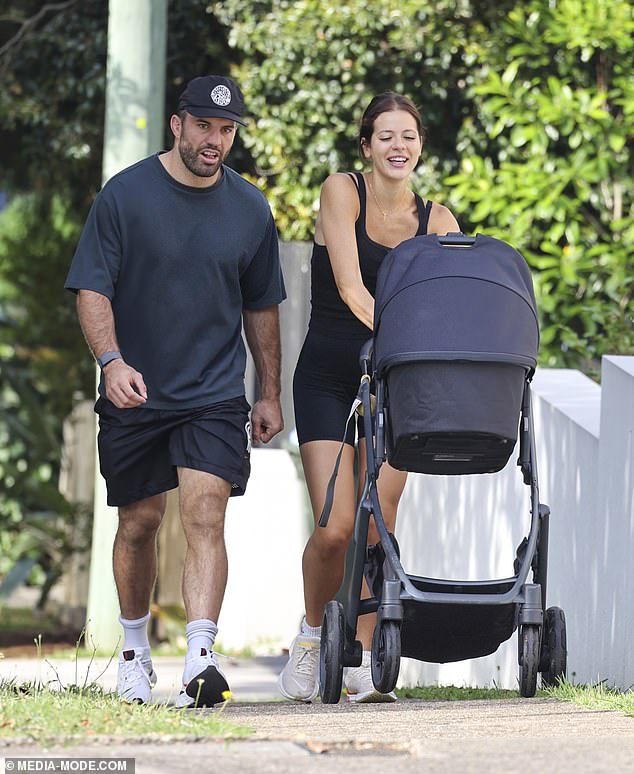 NRL star James Tedesco, 30, (left) and his wife Maria stepped out for a casual stroll with their newborn daughter Rosie on Sunday