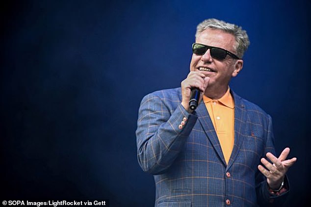 Singer Graham McPherson, known by his stage name Suggs, performs all the hits with his Band Madness at Tramlines Festival in Sheffield