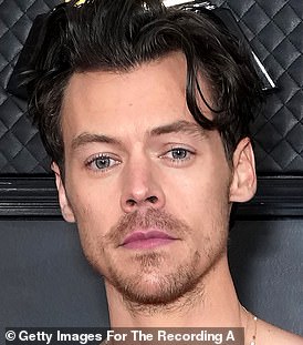 As he was: Harry's fans have a meltdown amid claims he has shaved off his famous locks (pictured in February)