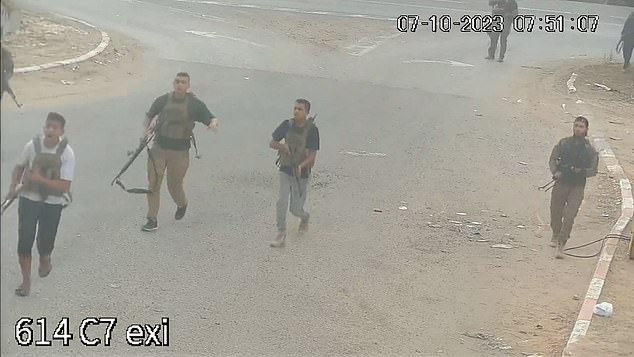 Hamas gunmen are seen storming a gas station while firing erratically