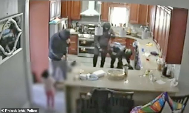 Video shows a Philadelphia family being tied up and held at gunpoint by a group of men wearing masks as their young children watched