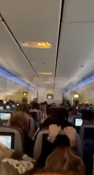 In a video circulating on social media, passengers can be seen grabbing the seats in front of them, with screams and shouts audible