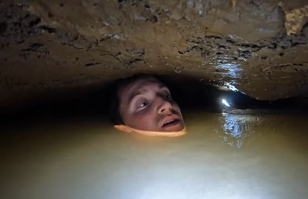 Footage shows the moment a caver almost drowned while neck deep in underground water - after one of his companions caused him to lose his grip and become completely submerged