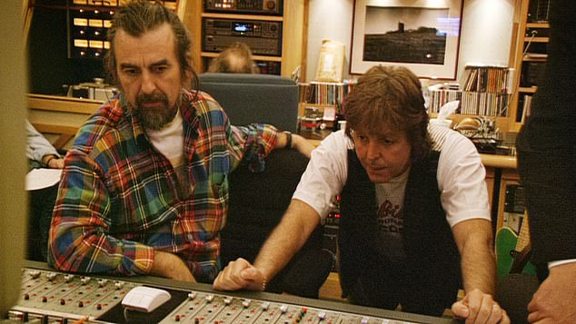 Sir Paul McCartney pictured in the 1990s with George Harrison, who performed the guitar song in 1995 before dying in 2001