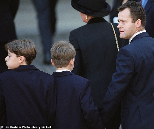 Paul Burrell holding hands with his sons as they arrive at Westminster Abbey for the funeral of The Princess Of Wales in 1997