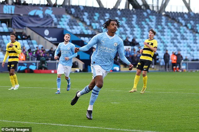 The son of a former Premier League star (above) scored on his debut for Man City's U19s on Tuesday