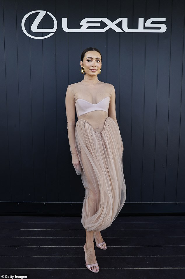 Rozalia Russian opted for an awkward nude dress for today