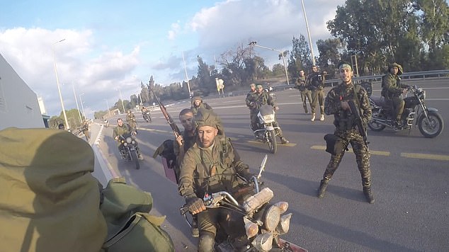 Dramatic bodycam footage shows a terror group in khaki pants riding a motorcycle in a convoy on October 7